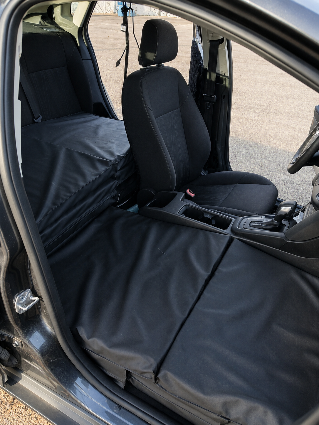 PupTaxi Comfort Cruiser interior showing removed passenger seat replaced with padded protective cover for dog transport