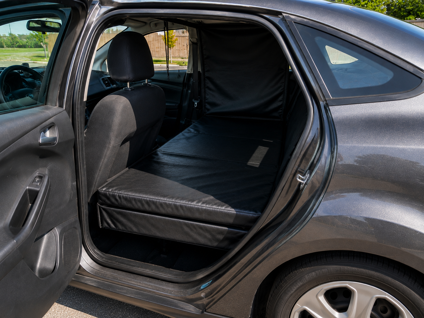 PupTaxi vehicle rear cabin with seats removed showing flat padded floor and lined walls for safe dog transport